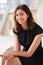 Vertical portrait of young mixed race Asian businesswoman