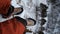 Vertical POV video of a hiker`s legs sitting on top of a mountain.