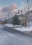 Vertical Puffy clouds at sunset Townhouses exterior with attached garage and a driveway cleared