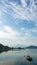 Vertical red fishing boat on peaceful lake