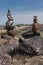 Vertical of rock cairns along state highway nine in New Mexico.