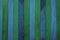 Vertical rough indigo blue and green theme wooden partition wall texture background.