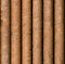 Vertical rusty pipe background seamlessly tileable