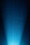 Vertical scattered blue ray on a dark blue background to a black dot