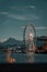 Vertical scenic shot of the Ferris Wheel in Lucerne between mountains and a lake