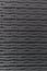 Vertical seamless carving wood pattern in black color by craftmanship / seamless texture / abstract background material / handmade