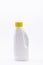 Vertical selective focus closeup of an alcohol gallon on a white background