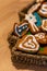 Vertical selective focus shot of gingerbread Christmas cookies in a Christmas tree-shaped basket