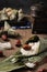 Vertical selective focus shot of preparation of rice dumplings with banana leaves