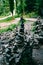 Vertical selective focus shot of rocks making a tower in the concept of balance