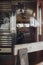 Vertical selective shot of black stools inside of an empty dining area