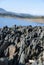 Vertical sharp edges of slate next to Gabriel y Galan reservoir in Extremadura