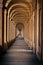 Vertical shot of 666 arches in Portici di Bologna towards Santuario Madonna di San Luca in Italy