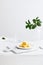 Vertical shot of aesthetic table setup with traditional Chinese osmanthus cake