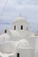 Vertical shot of Agii Anargiri Church in Megalochori village, Santorini Island