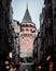 Vertical shot of an alley of buildings looking at The Galata Tower in Istanbul, Turkey