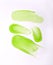 Vertical shot of the aloe green skincare textures slushed on a white background
