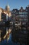 Vertical shot of the Amsterdam canal and the Basilica of Saint Nicholas in the Netherlands