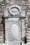 Vertical shot of the ancient carved white stone captured on a sunny day