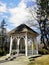 Vertical shot of an arbor and trees next to it in Park Norweski in Jelenia GÃ³ra, Poland