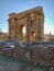 Vertical shot of an Arch of Trajan Ancient Roman landmark in Timgad, Algeria under a clear sky