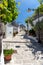 Vertical shot of architectures with cone roofs made of small stones in Alberobello, Italy