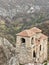 Vertical shot of the Assen\\\'s Fortress surrounded by rocks covered in trees at daytime in Bulgaria