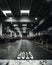 Vertical shot of an auto repair garage with various racks and shelves under the lights