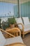 Vertical shot of a beautiful balcony with cozy armchairs