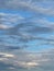 Vertical shot of beautiful cloudy blue sky above Morecambe Bay in Cumbria, England