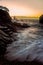 Vertical shot of a beautiful colorful sunriseon a mountainside