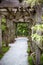 Vertical shot of a beautiful pathway decorated with green plants