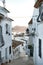 Vertical shot of a beautiful small district with white houses in Altea, Alicante, Spain