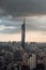 Vertical shot of the beautiful urban skyline of Kuala Lumpur at sunset with Warisan Merdeka Tower