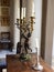 Vertical shot of beautiful vintage candlesticks on a wooden table