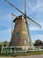 Vertical shot of bicycle in front windmill