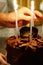 Vertical shot of a birthday celebration chocolate cake with candles