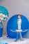 Vertical shot of a birthday table setting with balloons and a sailor figurine