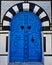 Vertical shot of a blue door in Sidi Bou Said located in Tunisia