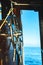 Vertical shot of a boat classic cabin from inside with a sea in the background