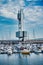 Vertical shot of boats in a port near a building in Coruna Galicia Spain