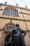 Vertical shot of the Bodleian Library and a statue in front of it in Oxford, UK