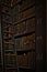 Vertical shot of bookshelves in the library with old volumes of books