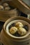 Vertical shot of a bowl of dumplings and vegetables