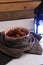 Vertical shot of a bowl of medjool dates in a decorative cloth on a table