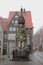 Vertical shot of the Bremen Roland statue with old buildings in the background on a gloomy day