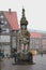 Vertical shot of the Bremen Roland statue with old buildings in the background on a gloomy day