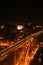 Vertical shot of the bridge in Porto, Portugal illuminated at night in the darkness