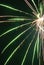 Vertical shot of bright neon firework light streaks