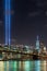 Vertical shot of brooklyn bridge park of new york city in USA with a beam of light towards the sky